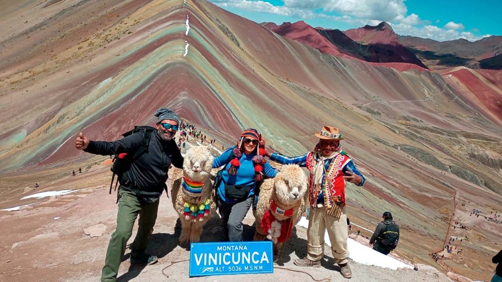 Vinicunca Rainbow Mountain summit 5036m with alpacas on Best Cusco Tour Package